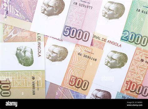 Angolan money a background Stock Photo - Alamy