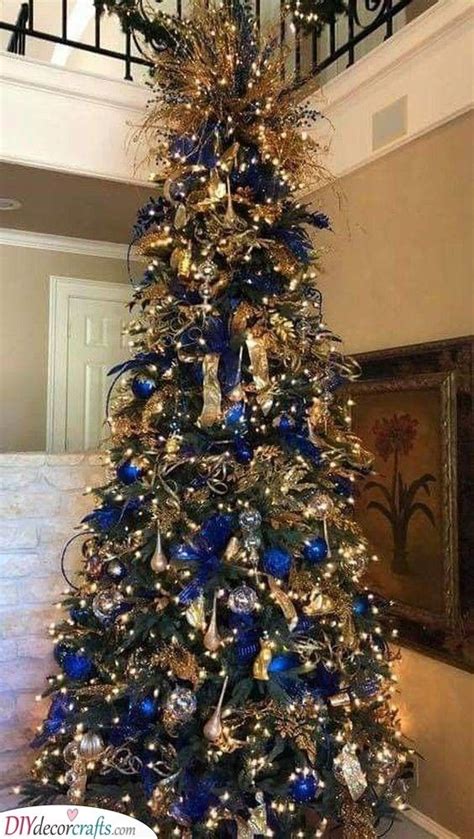 Gorgeous in Gold - Mixed With Blue | Blue christmas tree decorations, Amazing christmas trees ...