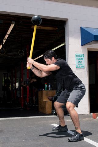 Sledgehammer Workout: Core Hammer Flagpole Squats and Matrix Situps | MostFit