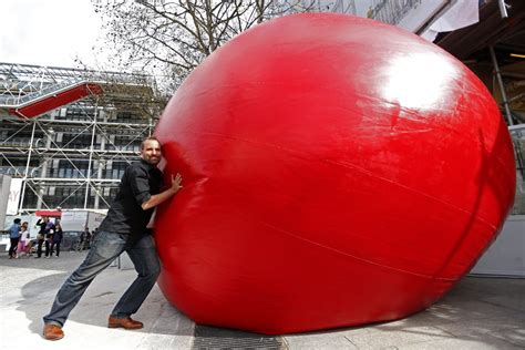 SEE IT: Giant red ball breaks free from art installation, rolls down Ohio street striking cars ...