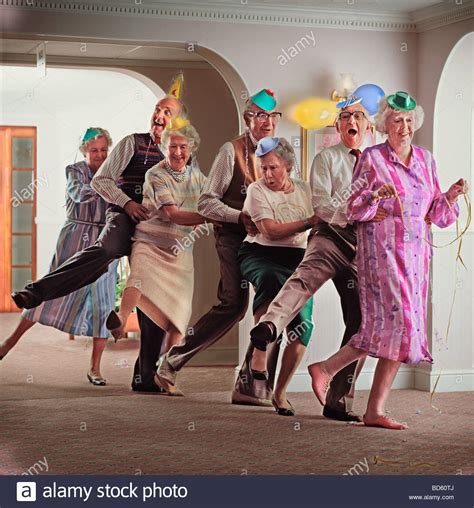 A group of old age pensioners dancing the conga Stock Photo: 25333298 ...