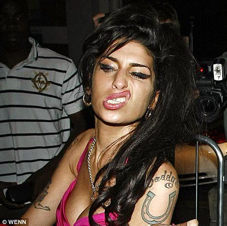 furniture quality control: Sneering Amy Winehouse ambles around looking worse for wear after ...