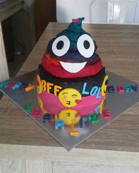 a birthday cake that has been decorated to look like an alien with eyes and mouth