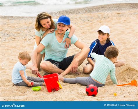 Parents with Children Playing in the Sand Stock Image - Image of playing, communicating: 43369869