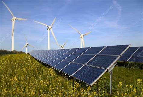 Solar panels and wind turbines in field - Stock Image - F003/7681 - Science Photo Library