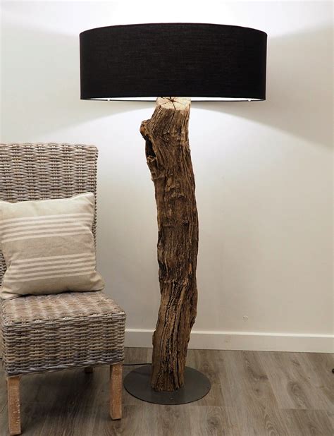 This Rustic floor medium lamp is a striking feature. It is sculptured from recycled Hard wood ...