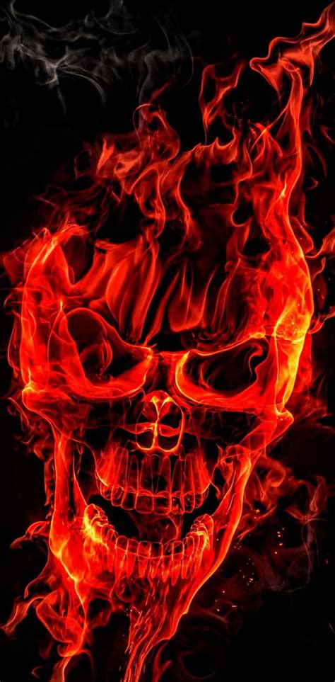 Download A Skull With Flames On A Black Background Wallpaper ...