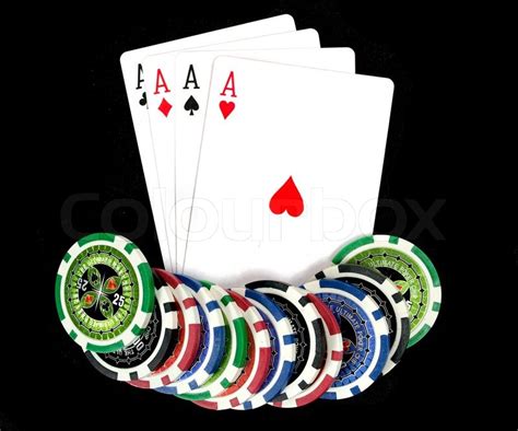 Cards and ultimate poker chips on black | Stock Photo | Colourbox