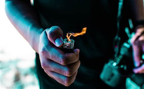 Person Holding Lighted Lighter · Free Stock Photo