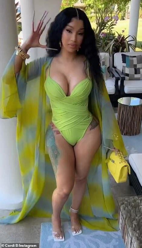 Cardi B in a swimsuit! The rapper flaunts her post-baby body in a lime green one-piece as she ...