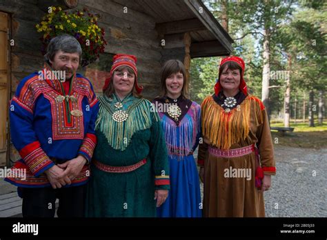 Sami family in traditional clothing near Ivalo, a village in Inari, Lapland, in northern Finland ...