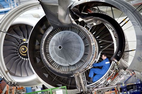 MAN IN THE MACHINE: A technician worked Monday on the engine of an Airbus A380 jet at the ...