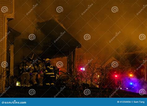 Firefighters Breaking into a Burning House Stock Photo - Image of burn, firefighter: 41254456