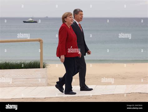 German Prime Minister Angela Merkel and her husband Ulrich head for the ...