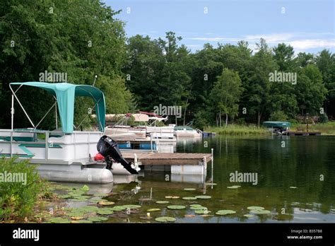 Homeowner docks on Otter Lake near Waupaca Wisconsin Stock Photo - Alamy