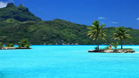 Download Crystal Clear Tropical Beach Island Wallpaper | Wallpapers.com