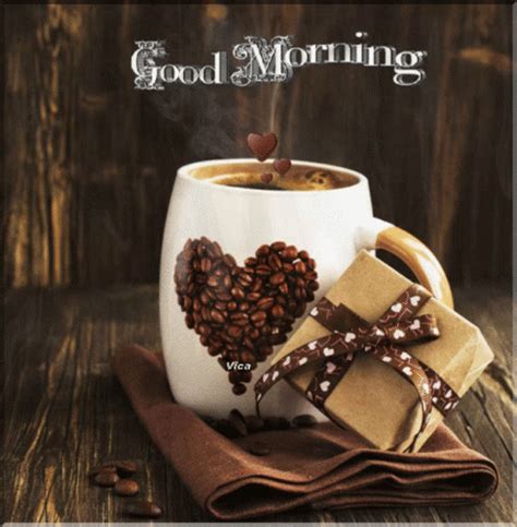 there is a cup of coffee with hearts on it and some wrapped presents ...