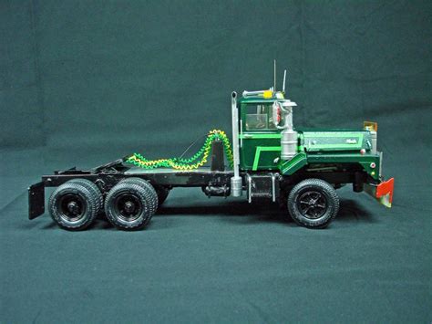 Built 1/25 scale model semi-trucks (2) Two Ertl Mack DM-800s and Payhauler | #1853190191