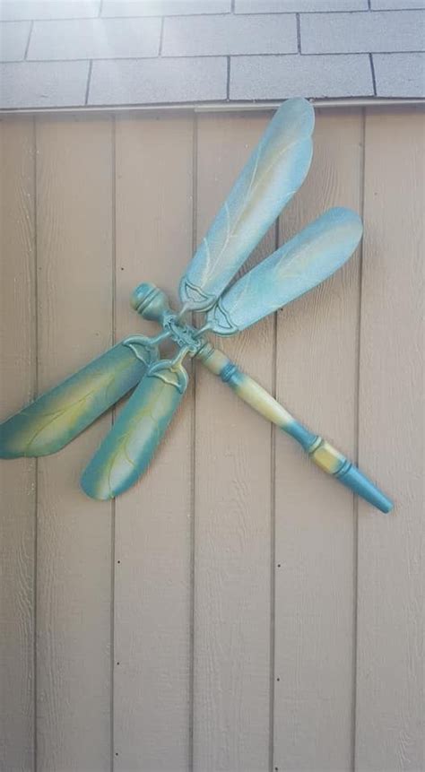 Repurposed ceiling fan blades | Dragonfly yard art, Ceiling fan crafts ...