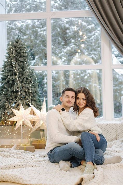 Christmas Couple Hug In Festive Home With Snow And Tree Photo ...