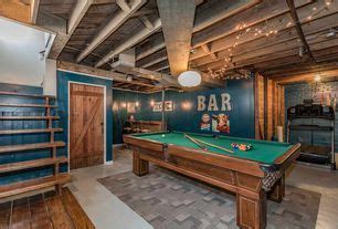 Rustic Game Room with Exposed beam, Pendant Light, Carpet, flush light, High ceiling, Concrete ...