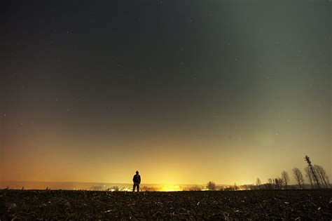 Royalty-Free photo: Person standing under gray starry sky | PickPik