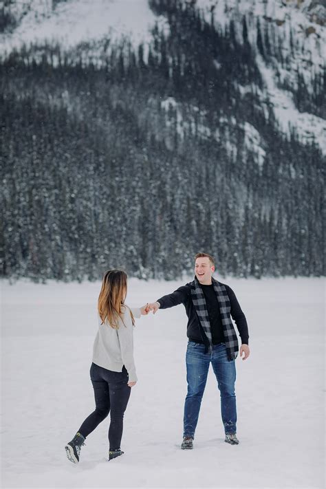 Lake Louise Vacation photos in winter with a snow fight in the mountains