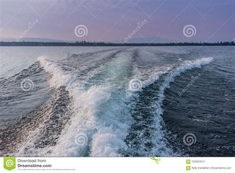 Boat Wake Over Jenny Lake stock photo. Image of summer - 102367614