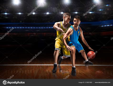 Two basketball players in scrimmage during basketball match — Stock Photo © PastaSevenSeven ...