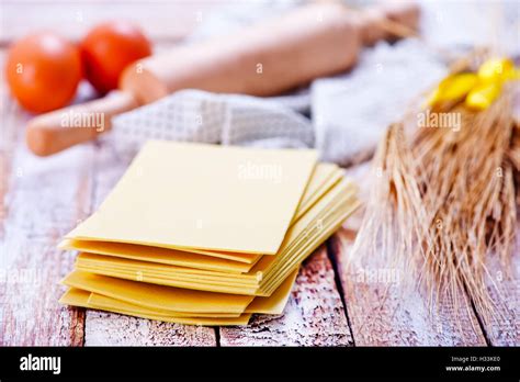 sheets for lasagna on the white table Stock Photo - Alamy