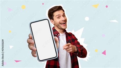 Foto de Cool handsome guy holding cell phone with white blank screen do Stock | Adobe Stock