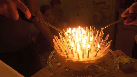 Lighting and blowing out 100 birthday candles - YouTube