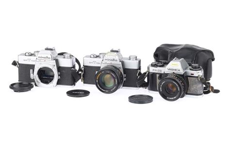 Lot 141 - Three 35mm SLR Cameras,