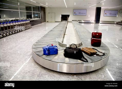 Baggage conveyor belt system area airport trolley passengers luggage ...