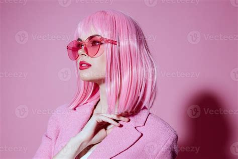 Portrait of a young woman in pink glasses cosmetics glamor emotions ...