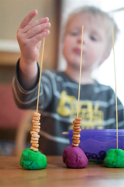 Threading Cheerios on Spaghetti! A Fantastic Fine Motor Activity for Toddlers | Toddler ...