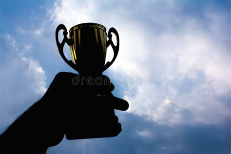 Hand Holding Winner Golden Trophy Stock Image - Image of prize, golden: 115855941