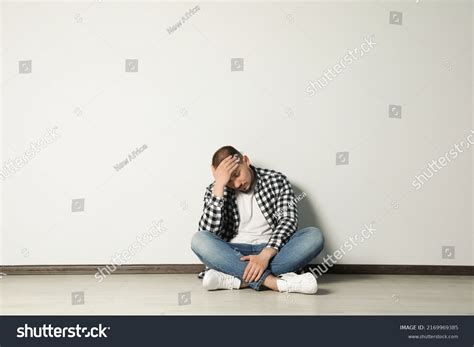 Sad Young Man Sitting On Floor Stock Photo 2169969385 | Shutterstock