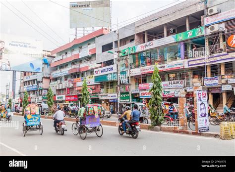 RAJSHAHI, BANGLADESH - NOVEMBER 10, 2016: Rickshaws on a road in ...