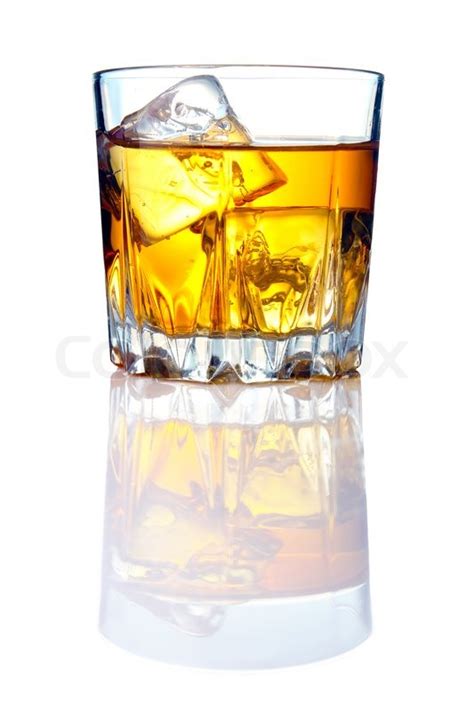 Whiskey glass with ice cubes and ... | Stock image | Colourbox