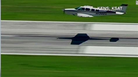 Plane's emergency landing without gear - CNN Video