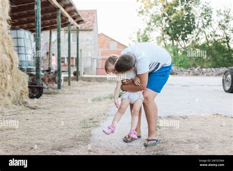 Brother and sister on the farm Stock Photo - Alamy