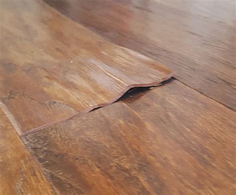 Fixing the Flooring after the Flood: How to Patch Damaged Wood Floors - Loving Here