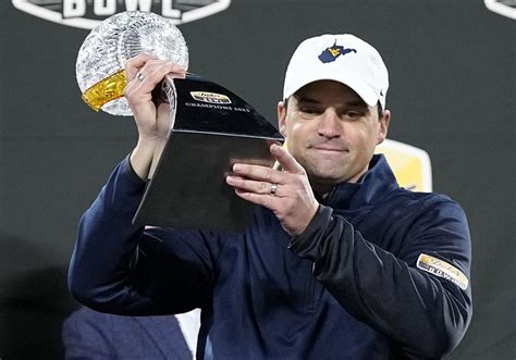 West Virginia football coach Neal Brown agrees to modest pay cut in 1 ...