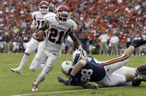 Arkansas Razorbacks football uniforms and helmets through the years