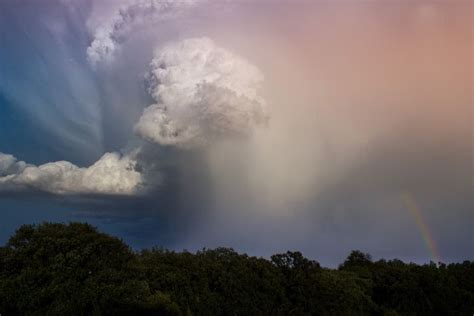 Storm clouds and a rainbow | Breathtaking views, Nebraska, Clouds