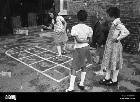 Junior school children playing playground games. South London. 1970s ...