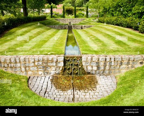 A water feature or rill in an English country garden on a summer's day Stock Photo - Alamy