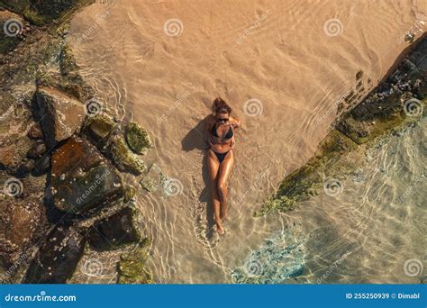 Top Aerial View of Tanned Woman in Bikini on the Rocky Beach on Summer Weekend Vacation Stock ...