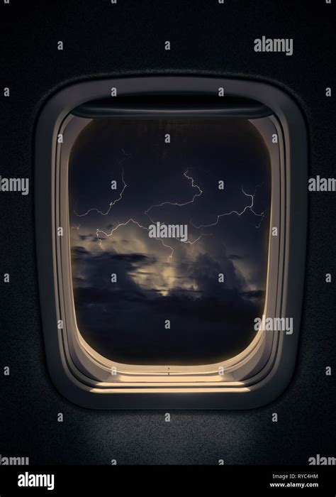 night thunderstorm with lightning seen from window airplane Stock Photo - Alamy